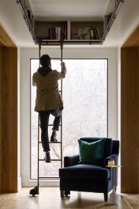 Ladder to book shelving in custom home office