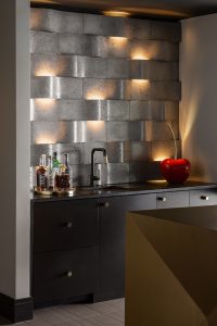 Custom home bar with lighting element in accent wall