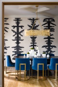 Rorschach ink painted in black on the walls with blue and gold accents