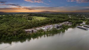 Zoomed out view of custom built Belton MO home and surrounding land