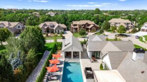 Pool deck and pool house at custom built Overland Park KS home