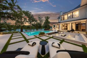 View of back yard and pool of Belton MO custom built home