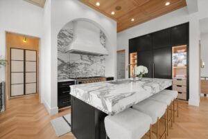 View of kitchen and custom fridge in Belton MO luxury home
