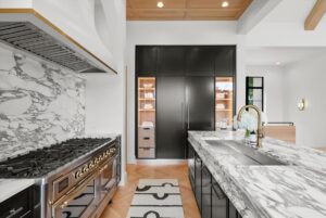 View of kitchen and custom fridge in Belton MO luxury home