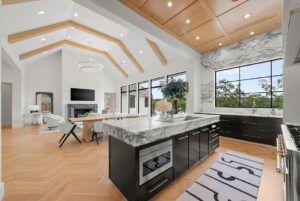 View of kitchen and dining and living area in custom built Belton MO home