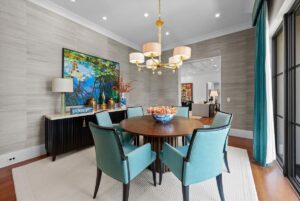 Dining area overlooking the pool in luxurious custom home in Overland Park KS
