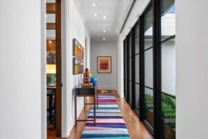 Hallway with floor to ceiling windows in luxury custom home in Overland Park KS