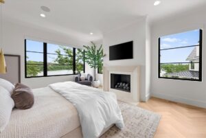 Master suite with fire place in custom built luxury Belton MO home