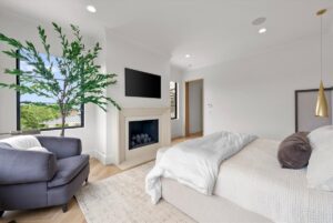 Master suite with fire place in custom built luxury Belton MO home