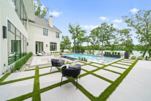 View of the backyard and pool of custom built Belton MO home