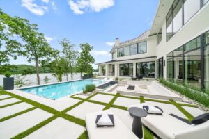 View of the backyard and pool of custom built Belton MO home