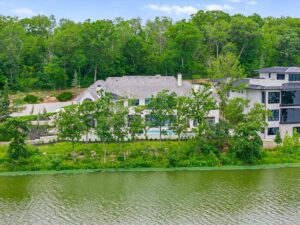 View from the lake of custom built Belton MO home