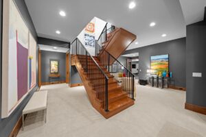 Stairs in finished basement in custom Overland Park Kansas home