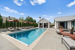 Outside deck furniture and pool at luxury home in Overland Park Kansas