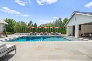 Outside deck furniture and pool at luxury home in Overland Park Kansas
