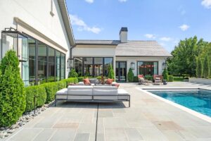 Outside deck furniture and pool at luxury home in Overland Park Kansas