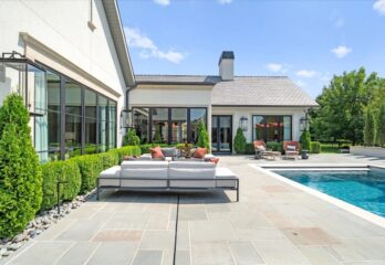 Pool deck and patio outside custom built home in Overland Park KS