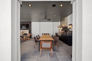 Indoor/Outdoor kitchen and eating area at luxurious Overland Park Kansas ranch